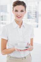 Business woman holding a cup