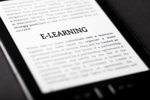 E-learning book on tablet touchpad, ebook concept