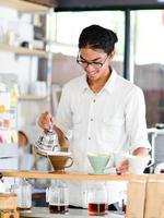 Barista brews single cup a coffee house
