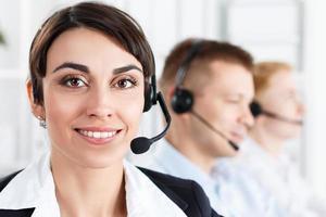 Three call center service operators at work photo