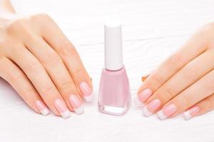 beautiful french manicure isolated on white