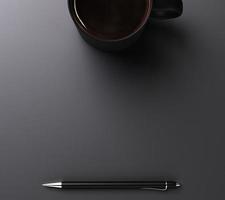 negro taza de café y bolígrafo con copyspace foto