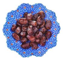 top view of sweet dates on iranian plate