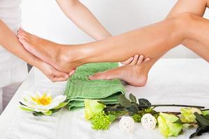 Woman Feet Undergoing Massage photo