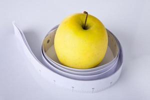 Apple and measuring tape photo