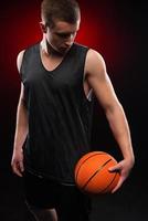 Caucasian basketball player holding the ball photo