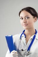 Smiling Caucasian Medical Female Doctor With Stethoscope photo