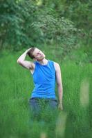 Caucasian man with eyes closed relaxing on meadow