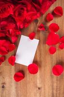 Bouquet of roses on wooden desk photo