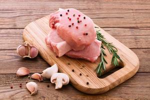 Raw pork meat on wooden desk photo