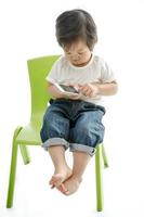 Little asian boy with smart phone
