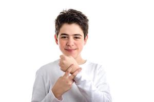 Caucasian smooth-skinned kid placing two fingers on left wrist