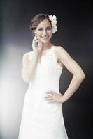 Glamorous young bride in wedding dress, smiling photo