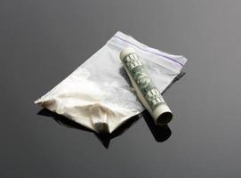Cocaine in package and one dollar bill photo