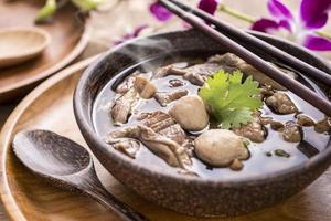 Beef Noodle Soup,Close up of a wooden bowl photo