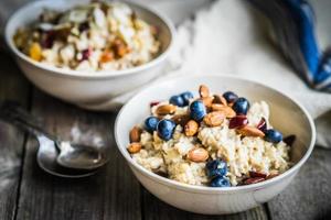 Oatmeal with berries and nuts photo