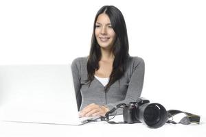 Photographer smiling in satisfaction at her images