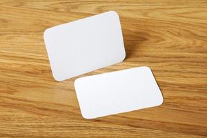 blank business cards on a wooden background photo