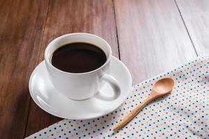 Coffee cup on wooden background photo