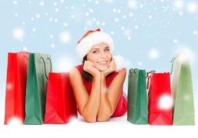 woman in red shirt with shopping bags photo