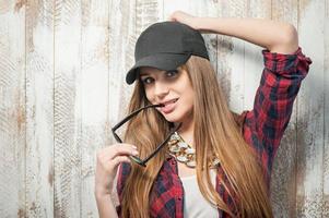 Pretty hipster woman with hat and glasses photo