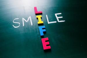 Smile life concept on blackboard