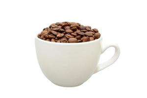white cup with coffee beans photo