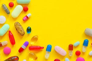 Many colorful pills isolated