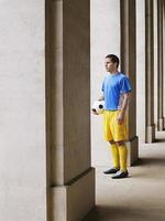 Soccer Player Holding Ball In Portico