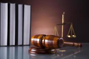 Golden scales of justice, gavel and books photo