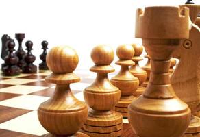 Chess pieces on a chess board photo