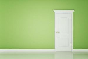 Closed white door on green wall photo
