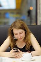 Young woman in a cafe photo