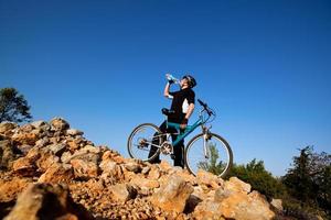 Cyclist drinking water. photo