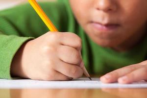 Elementary boy writing
