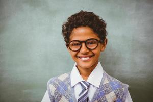 Cute little boy smiling in classroom photo