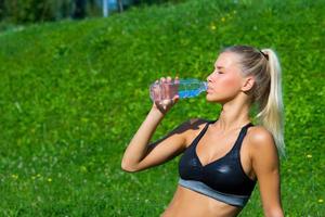 attractive girl drinking water photo