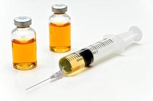 Vaccine with hypodermic syringe and needle photo