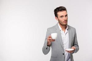 Happy businessman drinking coffee photo