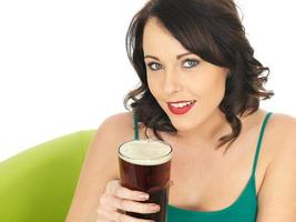 Attractive Young Woman Drinking Beer photo
