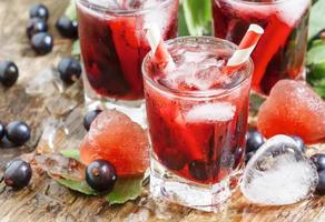 Fresh blackcurrant drink with berries photo