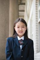 elementary schoolgirl in school uniform photo