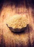 Brown sugar for Christmas baking in  bowl on wooden table, photo