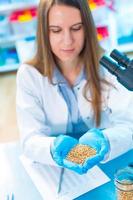 girl in the laboratory of food quality tests legumes grain photo