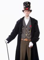 mago con sombrero alto, abrigo largo y detalles de piezas foto