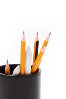Leather pencil cup with several pencils and stumps photo