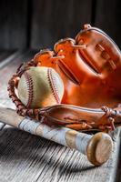 Old baseball ball and golden glove