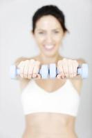 Woman using free weights