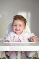 Cheerful Baby in Highchair