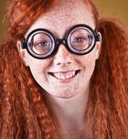 Cheerful freckled nerdy girl